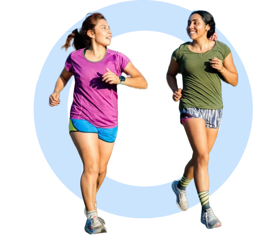 Group-1321317415 (1) Two women running in a circle of light.